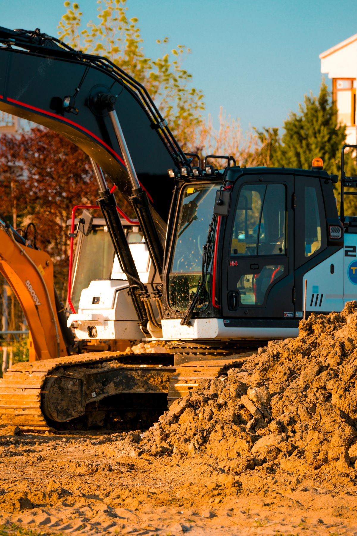 Excavators working at golden hour